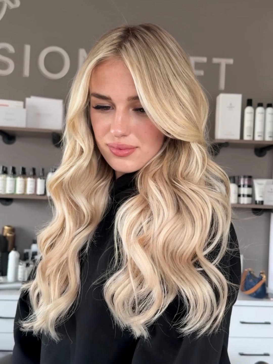 Full blonding on long, wavy hair